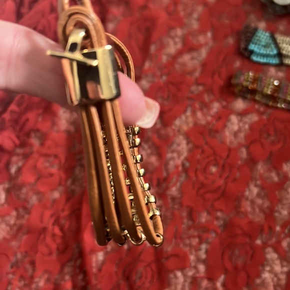 Two bracelets. One is stretch, Blue and silver and one has a clasp, tan and gold - Picture 2 of 7